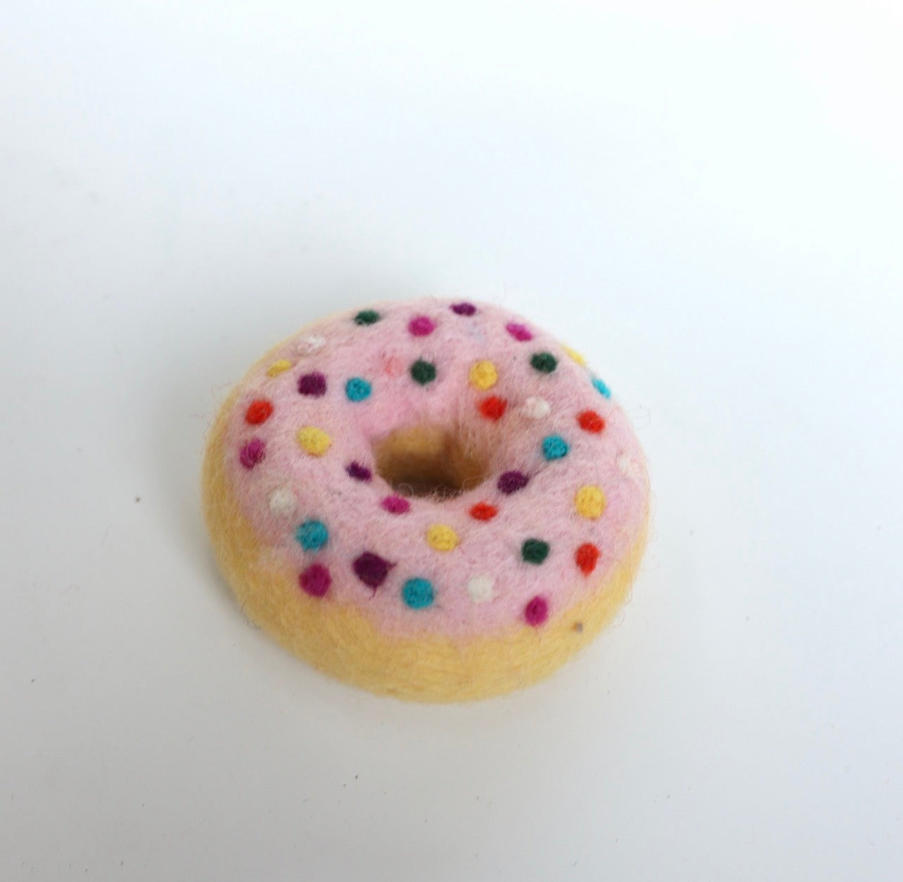 Pink sprinkle donut