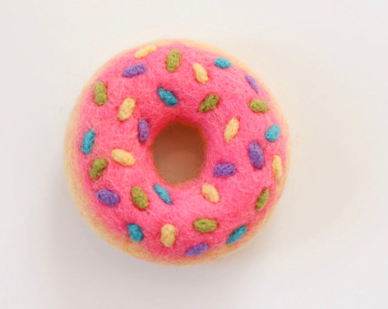 Hot pink sprinkle donut