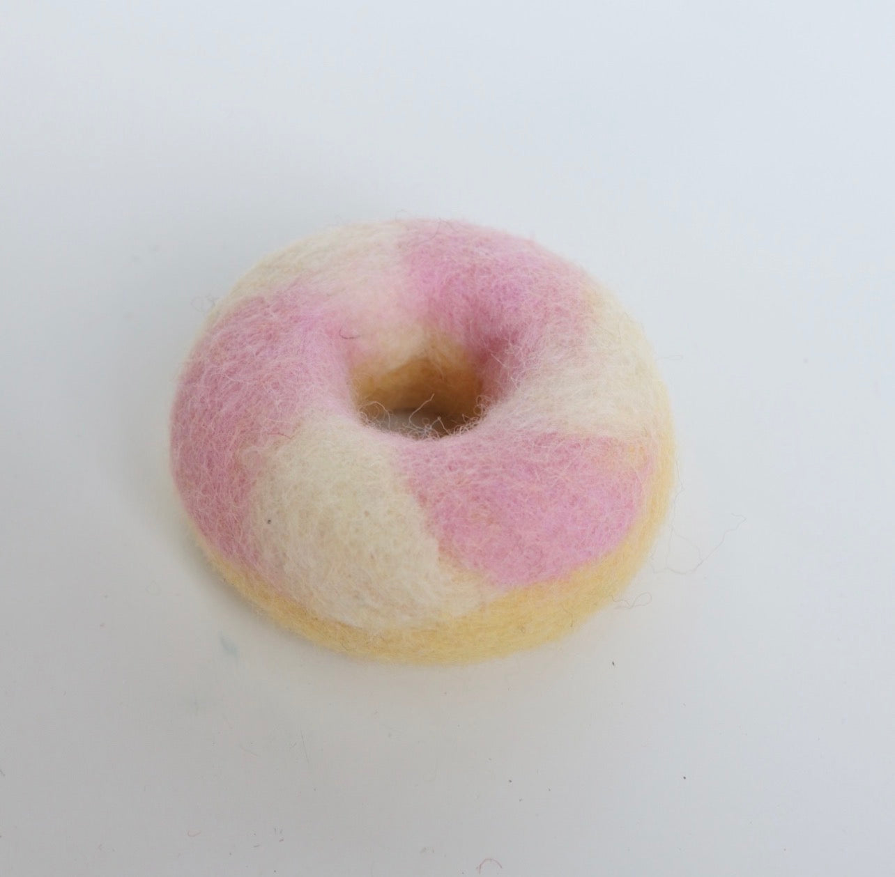 Pink swirled donut