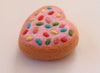 Pink love heart sprinkles donut
